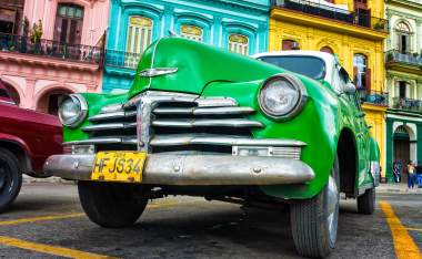 Old Chevrolet in front of colorful buildings November 282012 in Havana 120414844