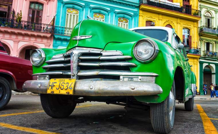 Old Chevrolet in front of colorful buildings November 282012 in Havana 120414844