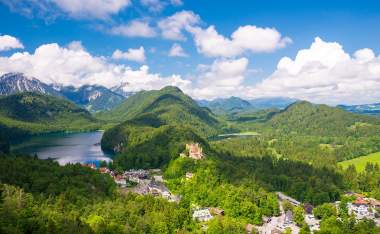 Castle-Hohenschwangau-eternal-forest-with-blue-mountains-and-lakes-of-Bavaria-Germany