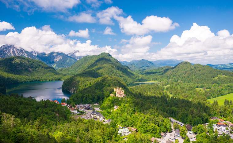 Castle-Hohenschwangau-eternal-forest-with-blue-mountains-and-lakes-of-Bavaria-Germany