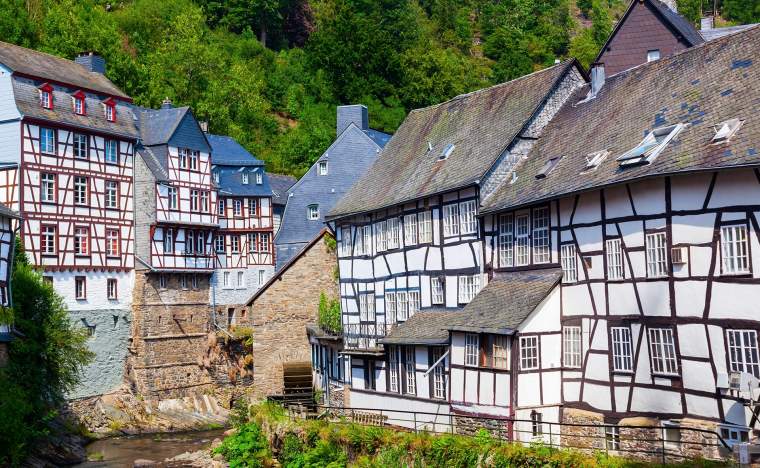 Old-half-timbered-houses-at-the-river-Rur-in-the-picturesque-Eifel-town-Monschau-in-Western-Germany