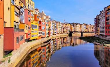 Colorful houses of Girona reflecting in the Onyar River
