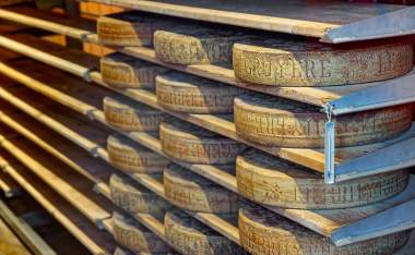 Aging-cheese-in-a-cellar-of-the-Maison-du-Gruyere-cheese-factory-in-Switzerland