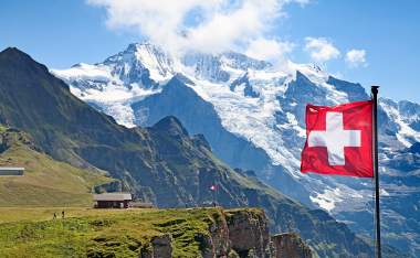 Swiss-flag-on-the-top-of-Mannlichen-Jungfrau-region-Bern-Switzerland