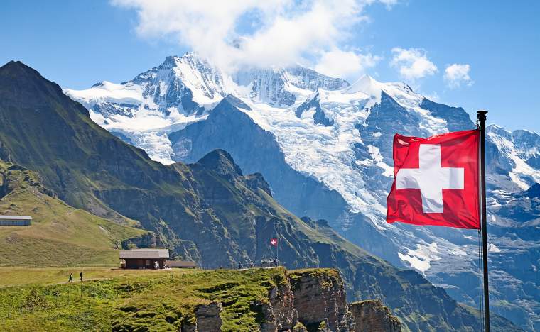 Swiss-flag-on-the-top-of-Mannlichen-Jungfrau-region-Bern-Switzerland