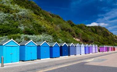 Colourful-wooden-beach-huts-at-Bournemouth-on-the-South-Coast-of-England