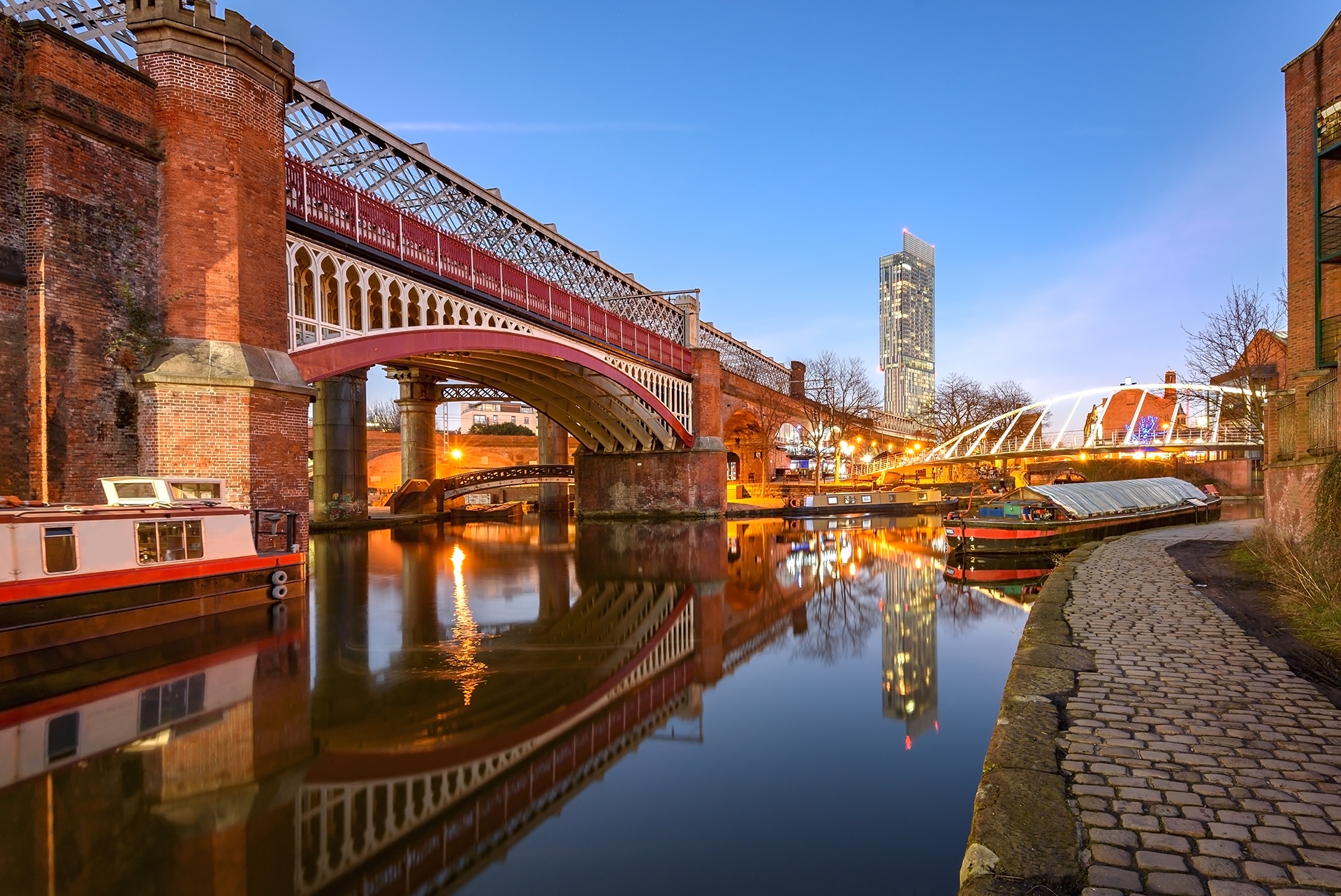 View of Manchester tallest building Beetham Tower reflecting in Manchester Canal