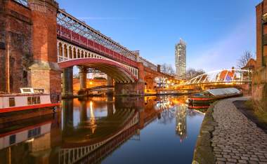 View of Manchester tallest building Beetham Tower reflecting in Manchester Canal