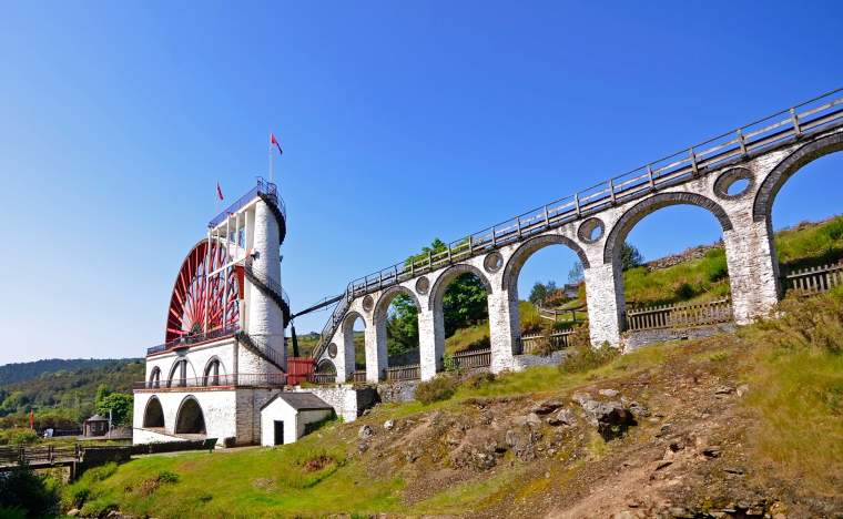 The Great Laxey Wheel with viaduct on sunny day Isle of Man